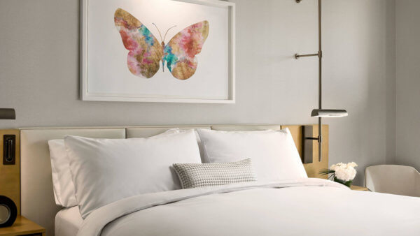 art-installation-colorful-butterfly-above-bed